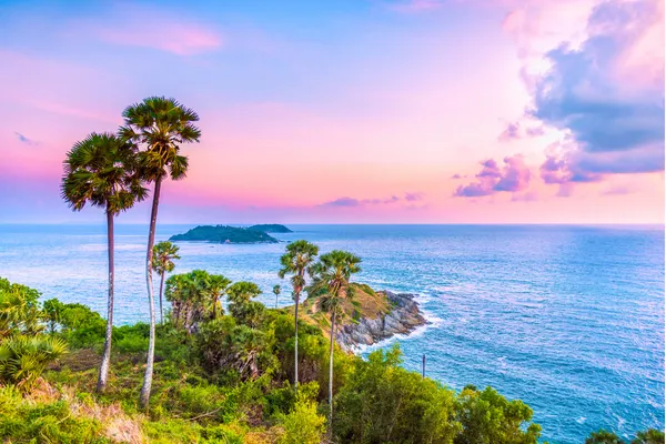 Phuket beach with crystal clear water and limestone cliffs